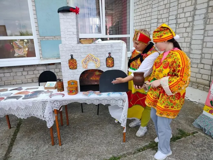 У печки